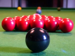 photo of balls racked and laid out on a snooker table