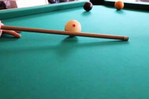 Image showing the pool cue striking through the cue ball