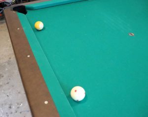 a photo of the cue ball and object ball lined up off the rail, object ball is one diamond away from pocket and cue ball is 3 diamonds away from pocket